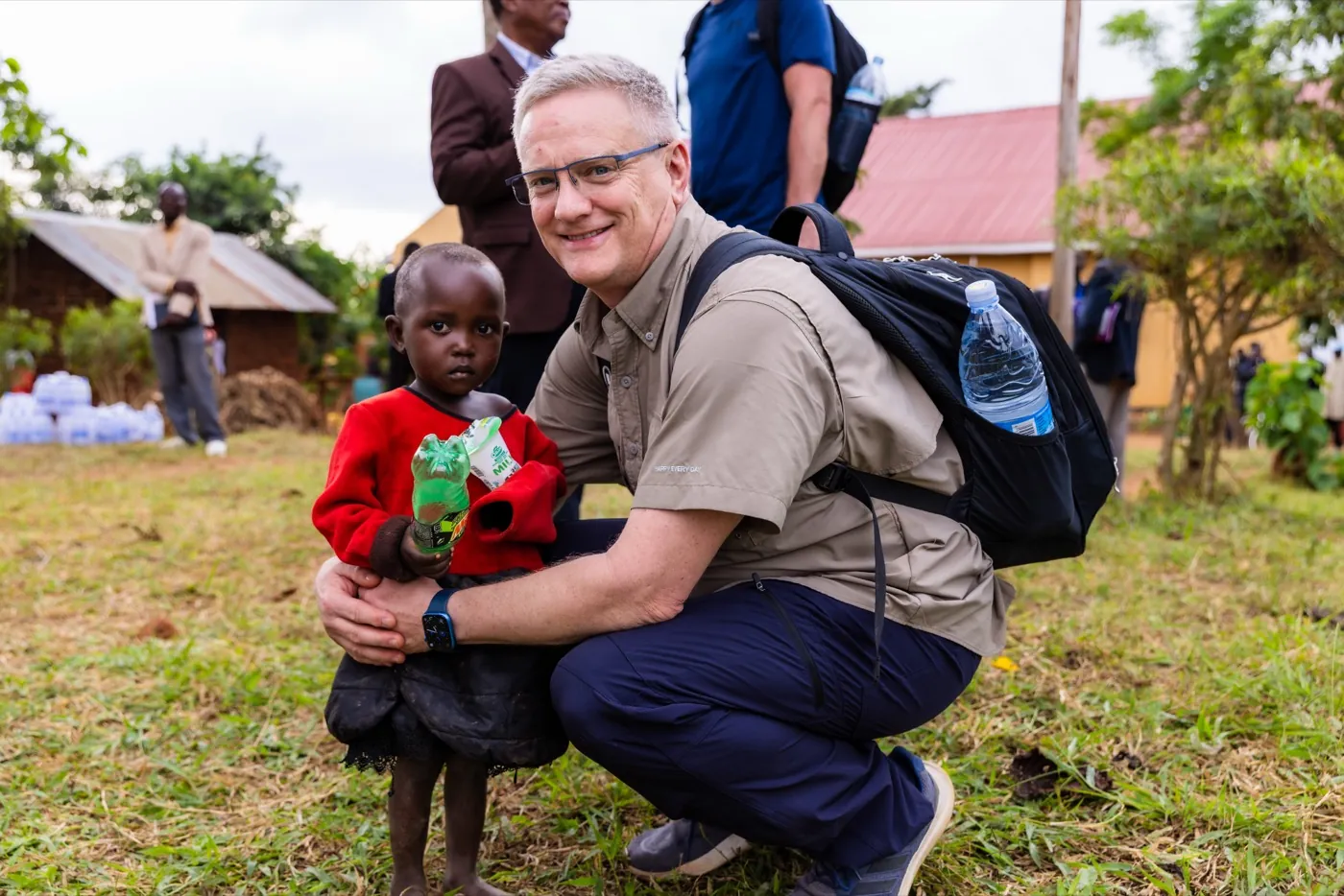 Team member with child, Africa mission trip 2026